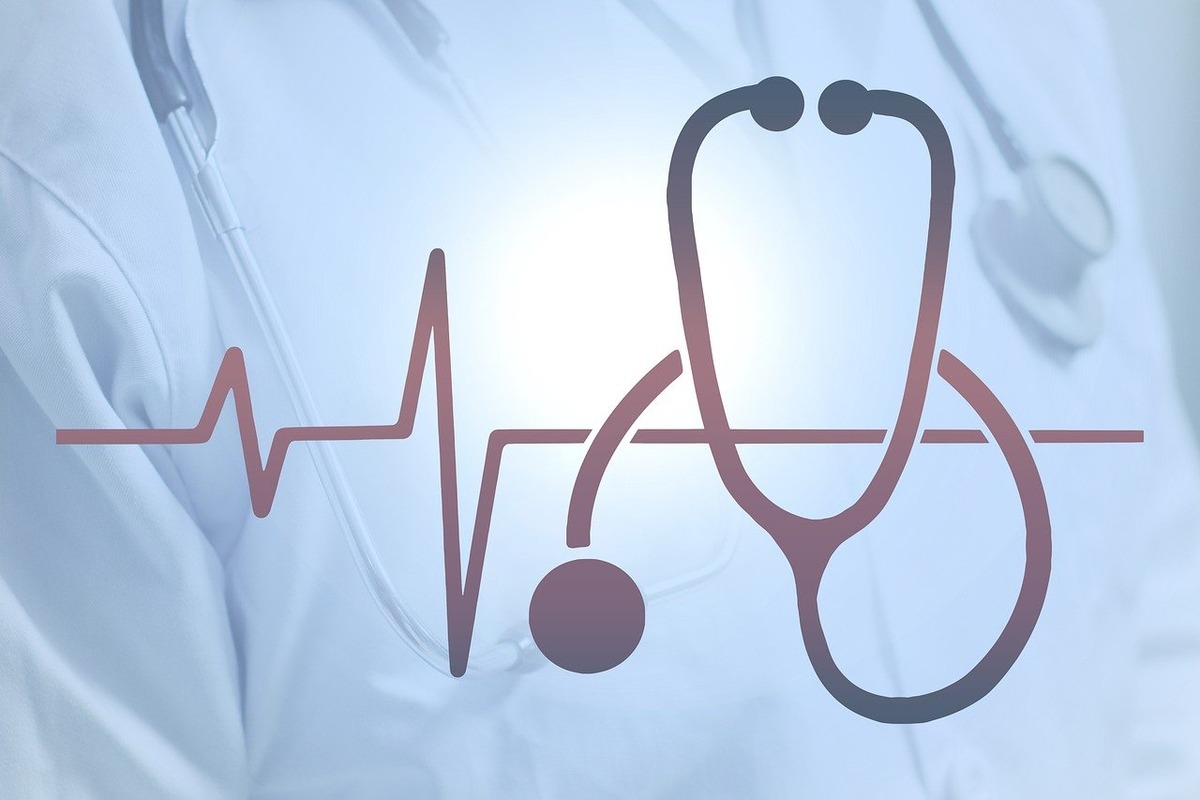 Stethoscope forming ECG line over lab coats and instruments, symbolizing heart health monitoring and medical diagnostics